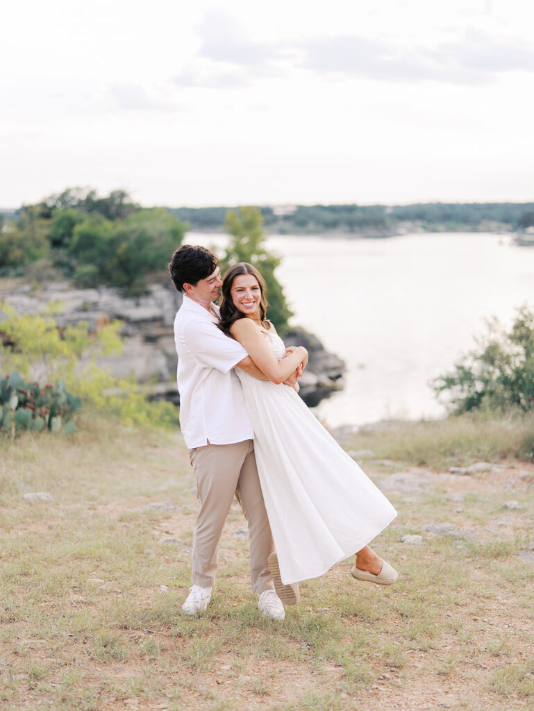 Playful and candid Lake Travis proposal photography of newly engaged couple enjoying the moment together.