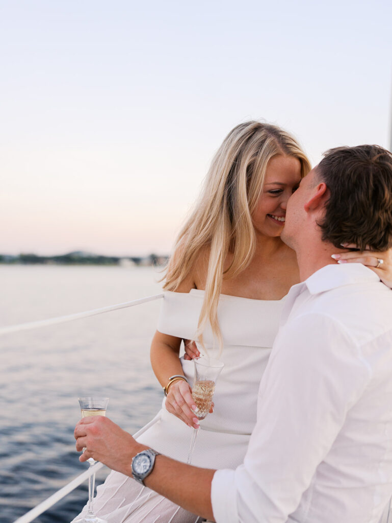 Ainslea and Carson’s Lake Travis sailboat engagement photos in glowing golden hour light, romantic and timeless.