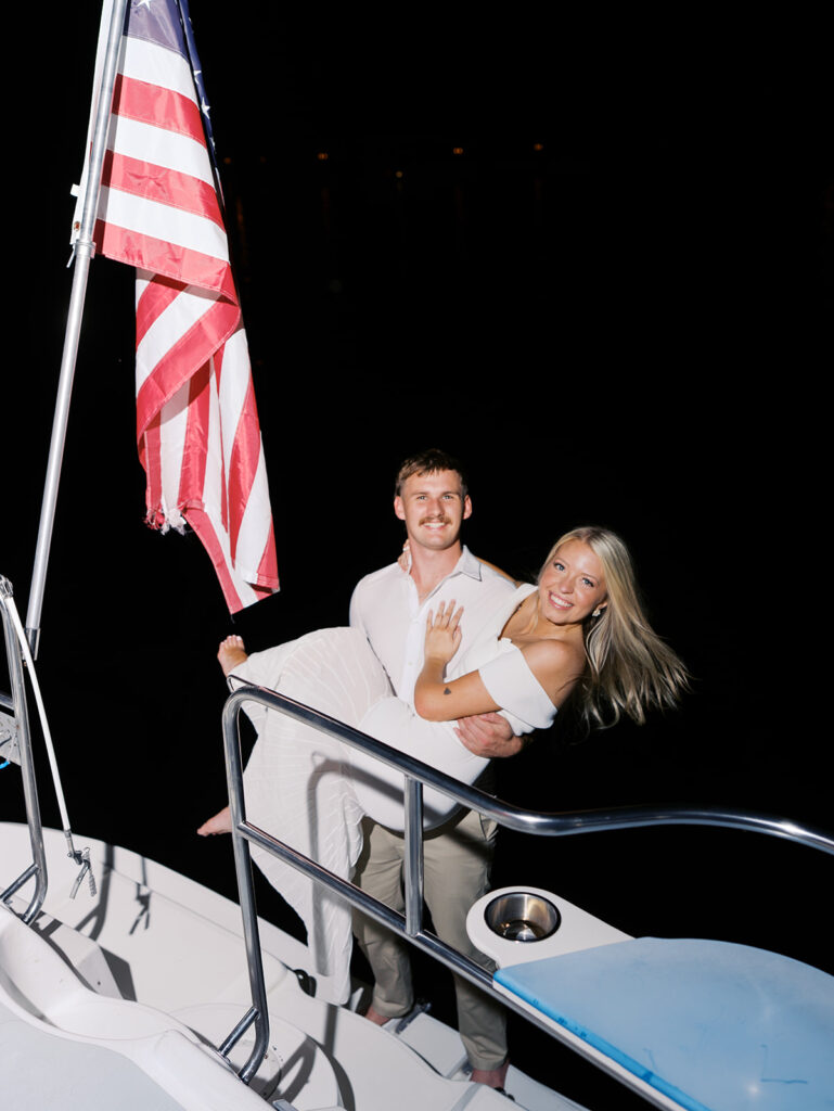 Playful Lake Travis sailboat engagement photos as the couple jumps off the boat for a spontaneous swim.