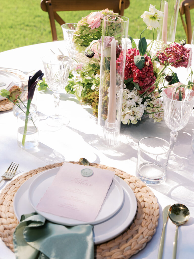 romantic southern wedding tablescape at The Adelphia with lush florals, soft candlelight, and elegant rentals styled by Simply Bliss Events.