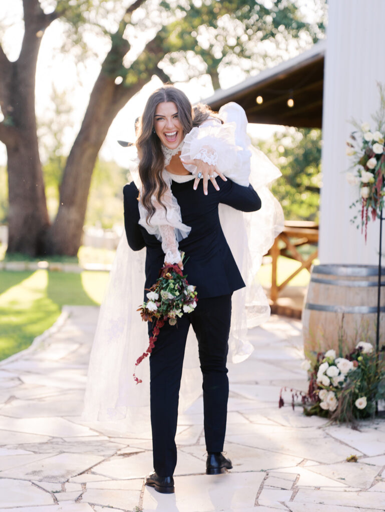 Bride and groom at The Adelphia wedding editorial in Lampasas, TX, surrounded by romantic florals and southern charm.