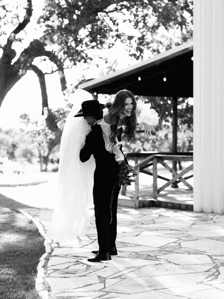 Bride and groom at The Adelphia wedding editorial in Lampasas, TX, surrounded by romantic florals and southern charm