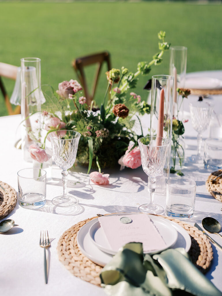 romantic southern wedding tablescape at The Adelphia with lush florals, soft candlelight, and elegant rentals styled by Simply Bliss Events.