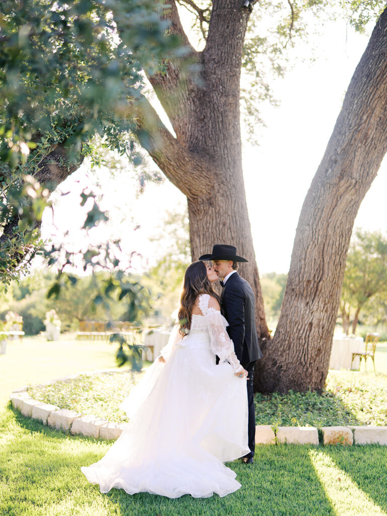 Bride and groom at The Adelphia wedding editorial in Lampasas, TX, surrounded by romantic florals and southern charm