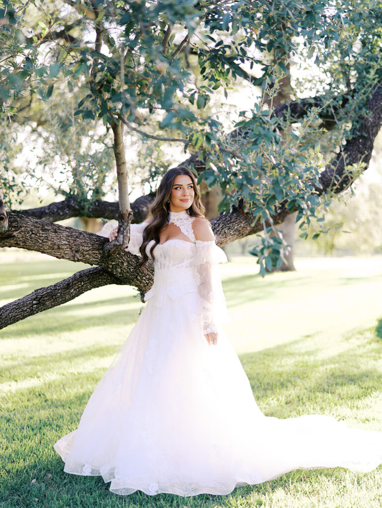 Bride and groom at The Adelphia wedding editorial in Lampasas, TX, surrounded by romantic florals and southern charm