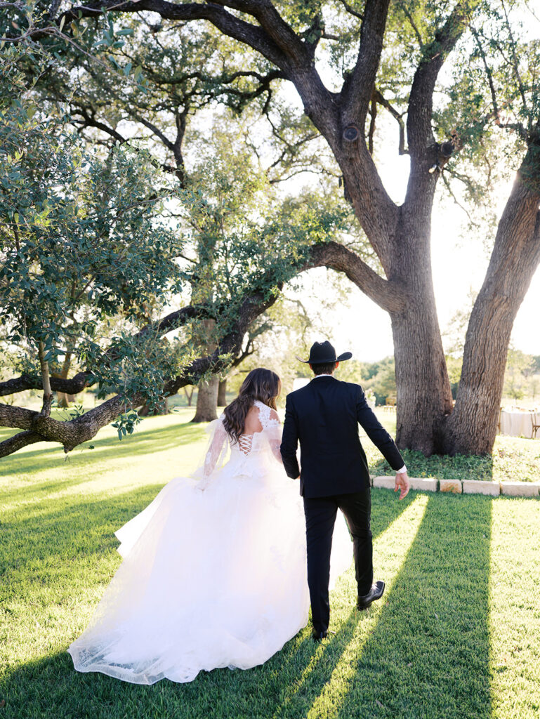 Bride and groom at The Adelphia wedding editorial in Lampasas, TX, surrounded by romantic florals and southern charm