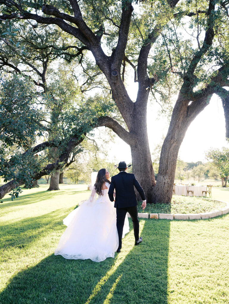 Bride and groom at The Adelphia wedding editorial in Lampasas, TX, surrounded by romantic florals and southern charm