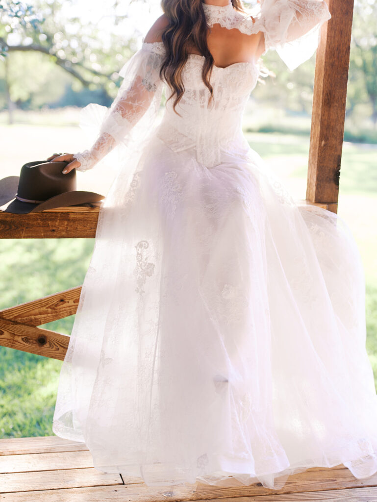 Bride and groom at The Adelphia wedding editorial in Lampasas, TX, surrounded by romantic florals and southern charm