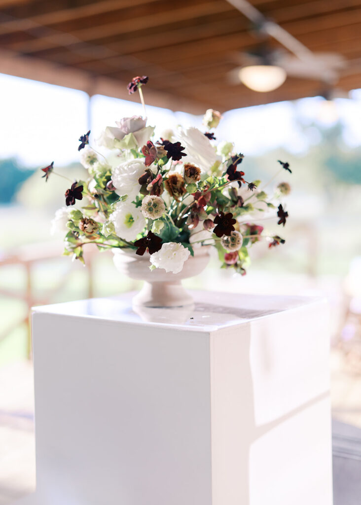 Romantic southern wedding tablescape at The Adelphia with lush florals, soft candlelight, and elegant rentals styled by Simply Bliss Events