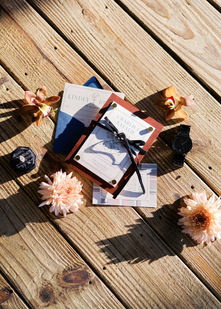 Refined wedding flat lay featuring romantic stationery by Anna & Ink, delicate florals, and timeless southern details.