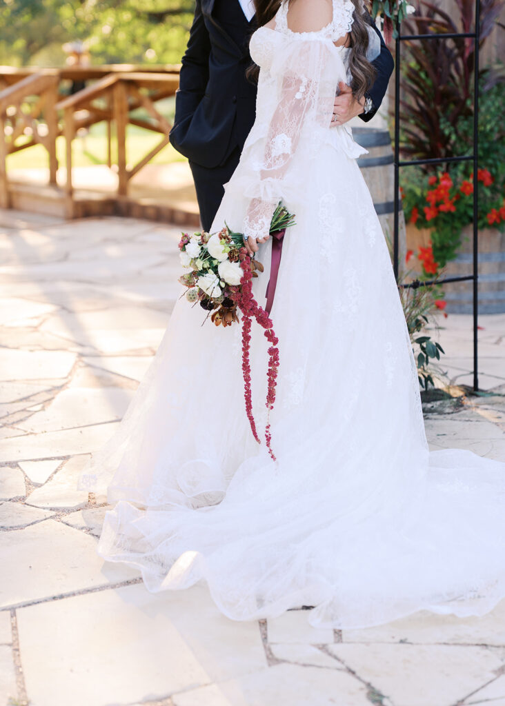 Bride and groom at The Adelphia wedding editorial in Lampasas, TX, surrounded by romantic florals and southern charm