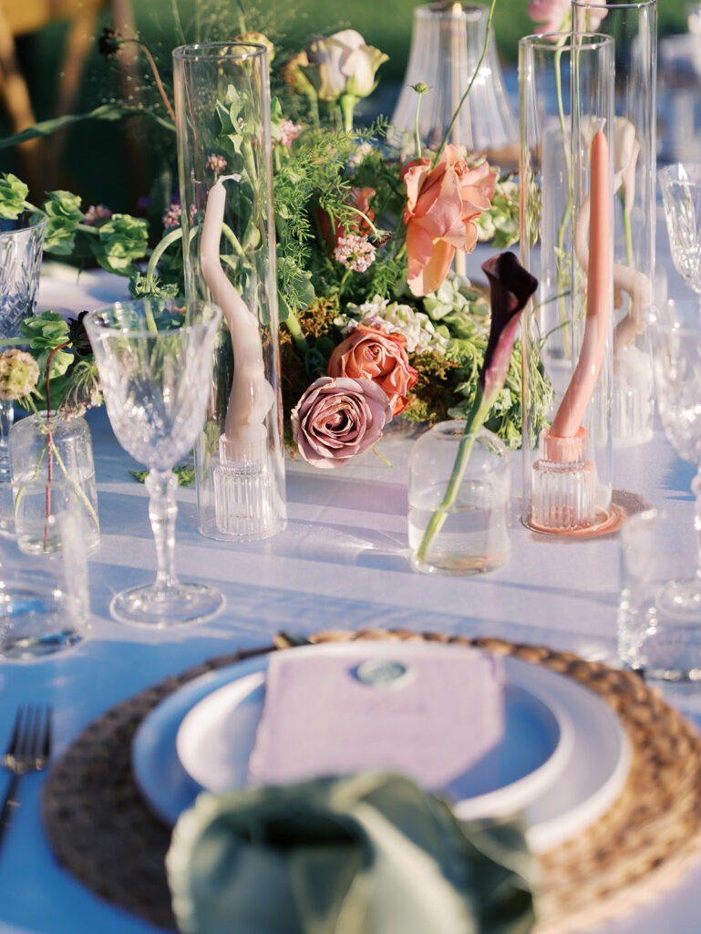 Romantic southern wedding tablescape at The Adelphia with lush florals, soft candlelight, and elegant rentals styled by Simply Bliss Events