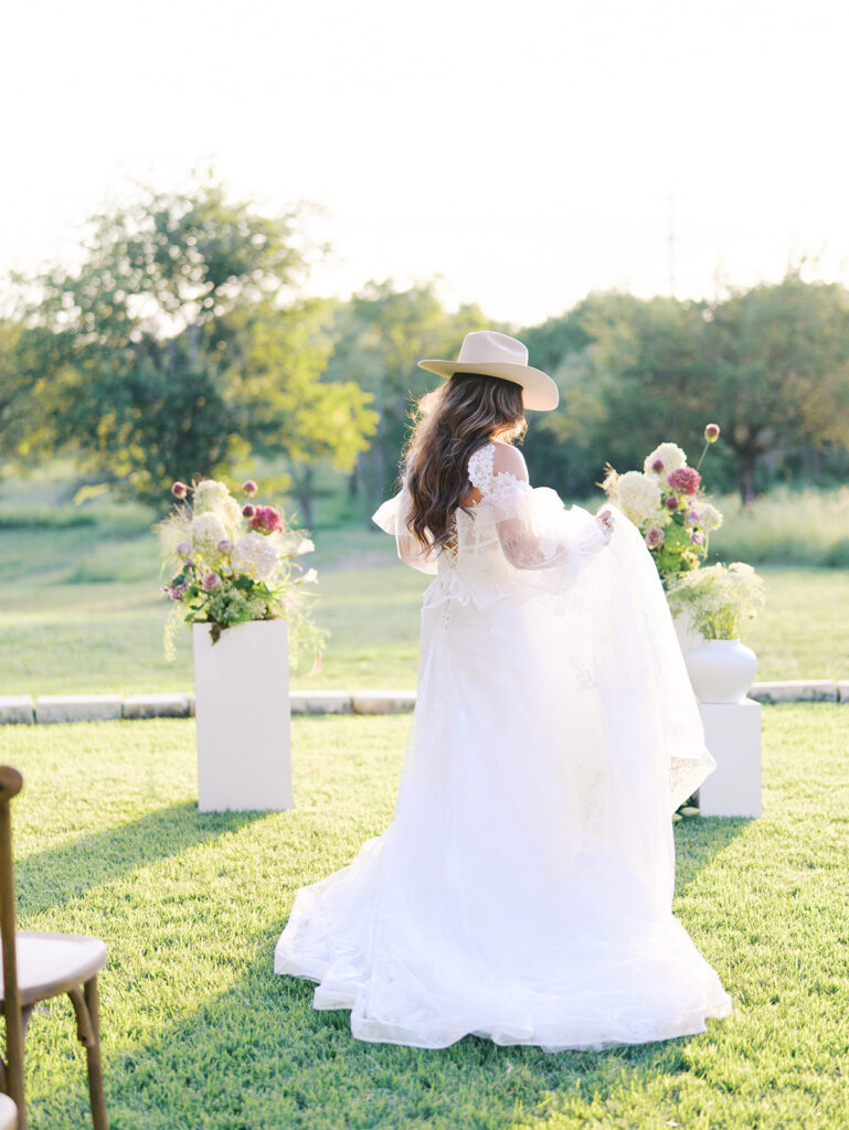 Bride and groom at The Adelphia wedding editorial in Lampasas, TX, surrounded by romantic florals and southern charm