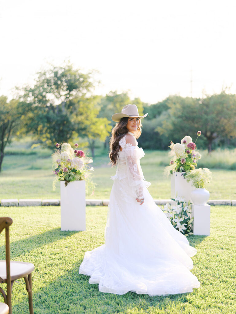 Bride and groom at The Adelphia wedding editorial in Lampasas, TX, surrounded by romantic florals and southern charm