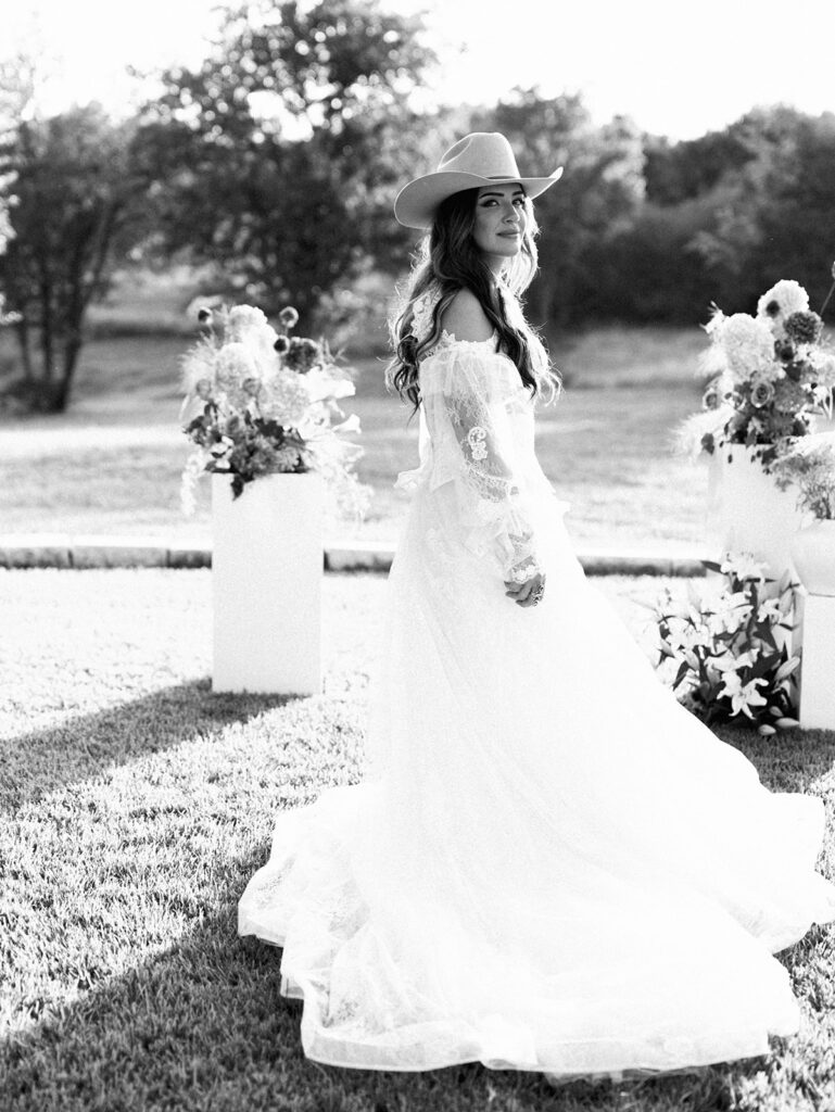 Bride and groom at The Adelphia wedding editorial in Lampasas, TX, surrounded by romantic florals and southern charm