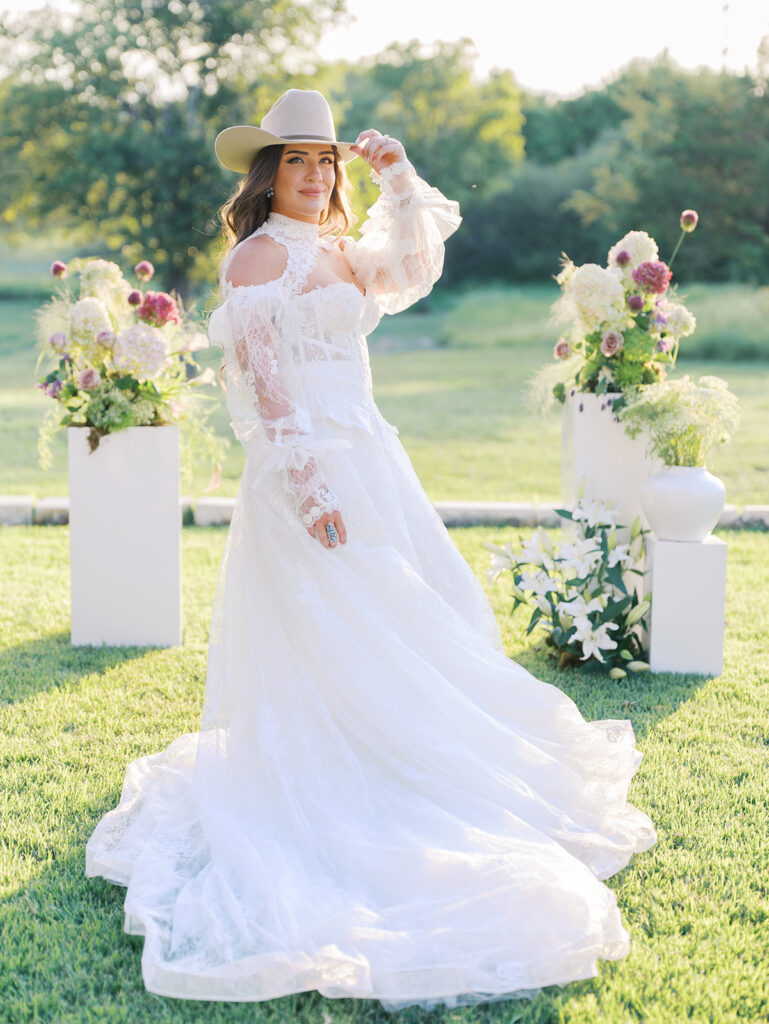 Bride and groom at The Adelphia wedding editorial in Lampasas, TX, surrounded by romantic florals and southern charm
