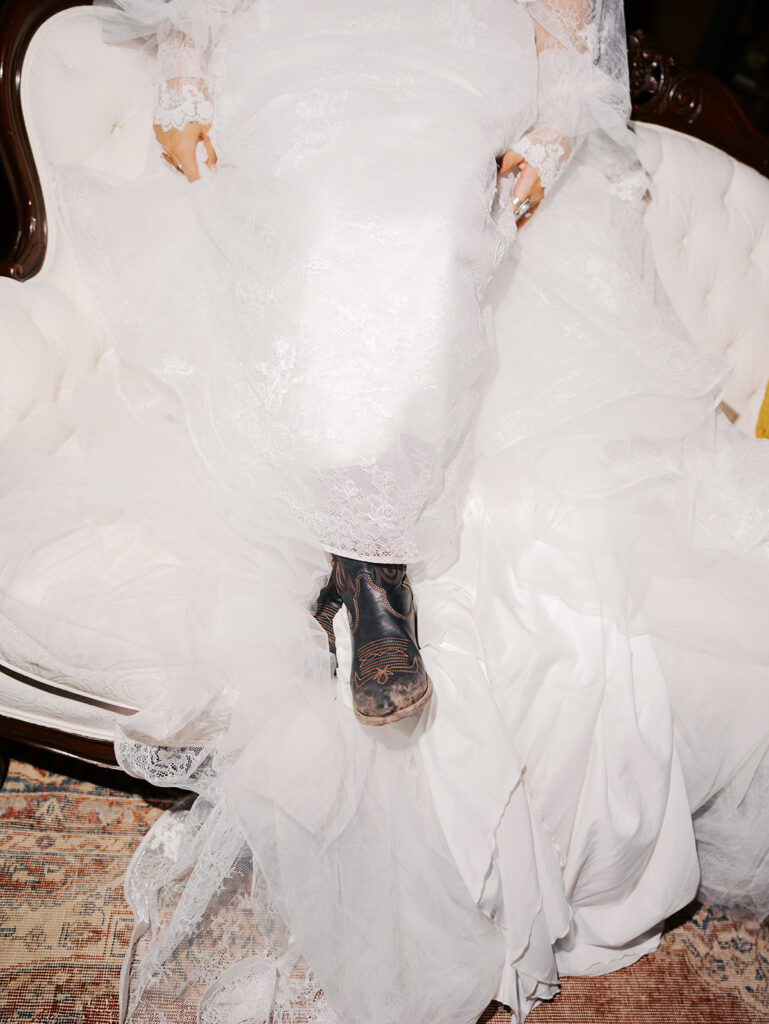 Bride and groom at The Adelphia wedding editorial in Lampasas, TX, surrounded by romantic florals and southern charm