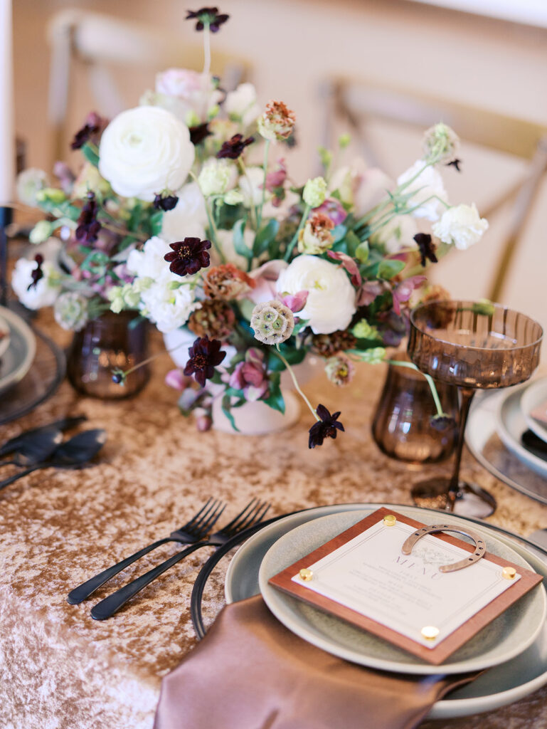 romantic southern wedding tablescape at The Adelphia with lush florals, soft candlelight, and elegant rentals styled by Simply Bliss Events.