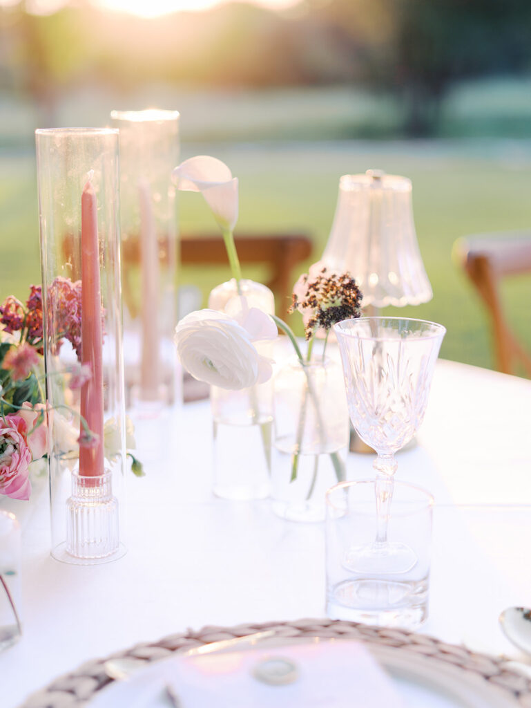 Romantic southern wedding tablescape at The Adelphia with lush florals, soft candlelight, and elegant rentals styled by Simply Bliss Events