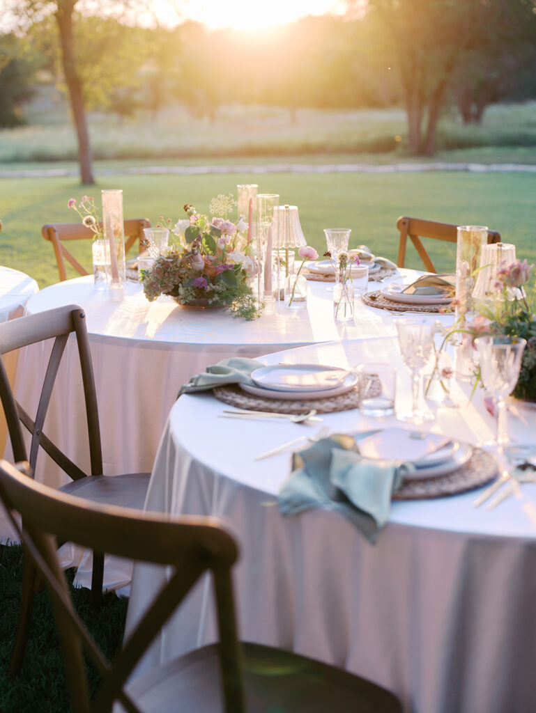 Romantic southern wedding tablescape at The Adelphia with lush florals, soft candlelight, and elegant rentals styled by Simply Bliss Events