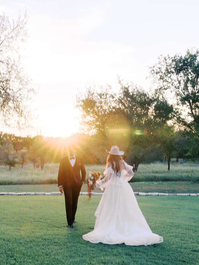 Bride and groom at The Adelphia wedding editorial in Lampasas, TX, surrounded by romantic florals and southern charm