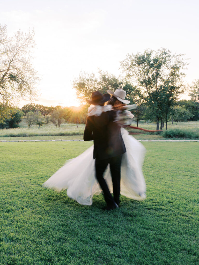 Bride and groom at The Adelphia wedding editorial in Lampasas, TX, surrounded by romantic florals and southern charm