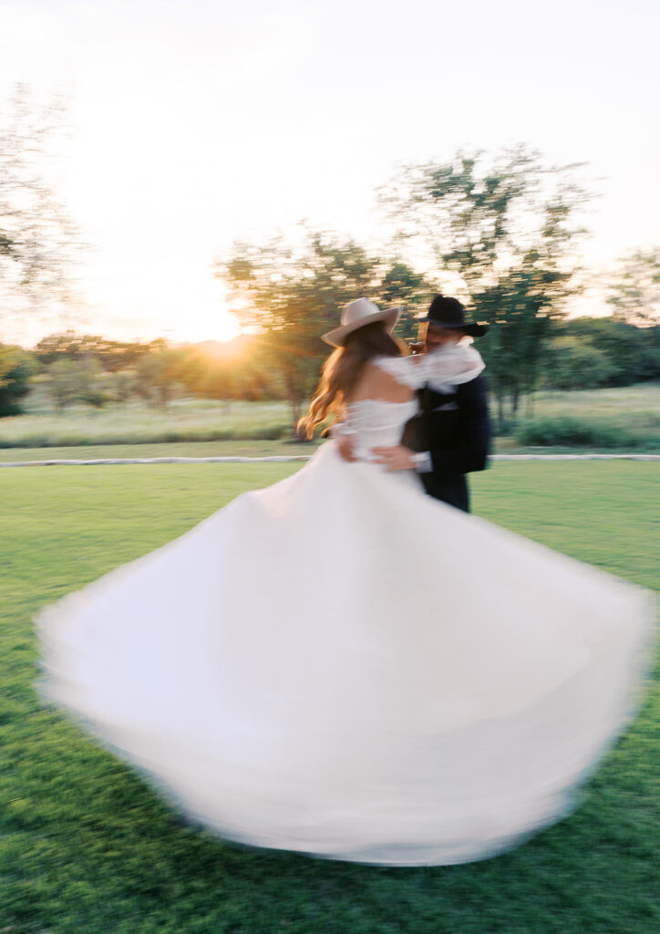 Bride and groom at The Adelphia wedding editorial in Lampasas, TX, surrounded by romantic florals and southern charm