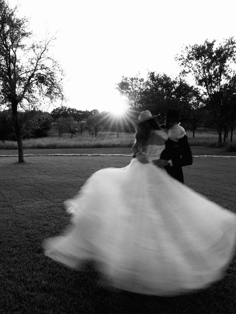 Bride and groom at The Adelphia wedding editorial in Lampasas, TX, surrounded by romantic florals and southern charm