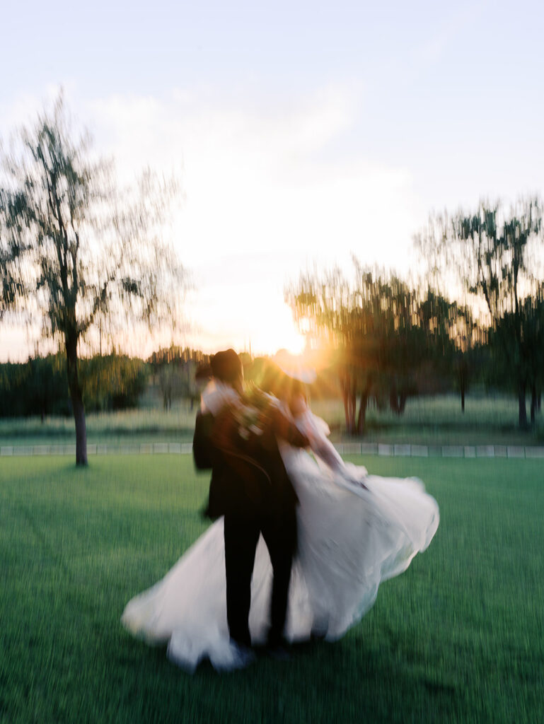 Bride and groom at The Adelphia wedding editorial in Lampasas, TX, surrounded by romantic florals and southern charm
