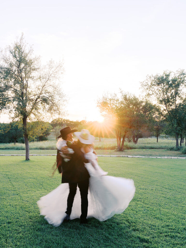 Bride and groom at The Adelphia wedding editorial in Lampasas, TX, surrounded by romantic florals and southern charm