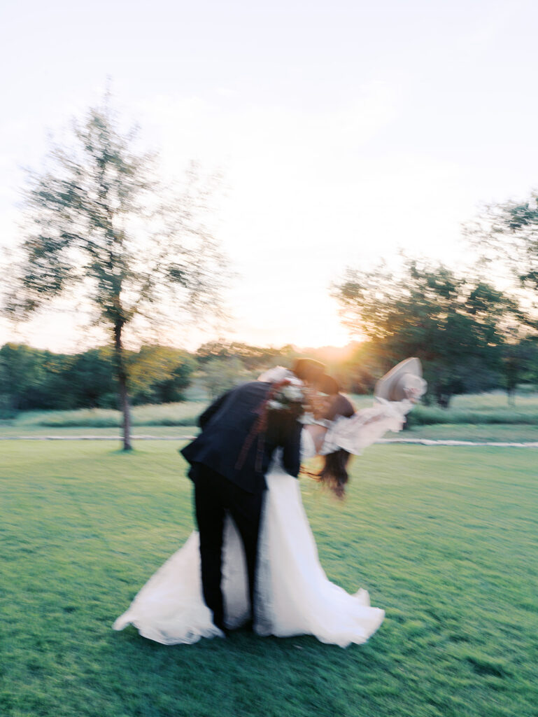 Bride and groom at The Adelphia wedding editorial in Lampasas, TX, surrounded by romantic florals and southern charm