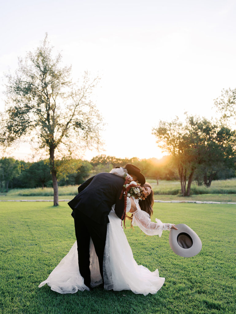 Bride and groom at The Adelphia wedding editorial in Lampasas, TX, surrounded by romantic florals and southern charm