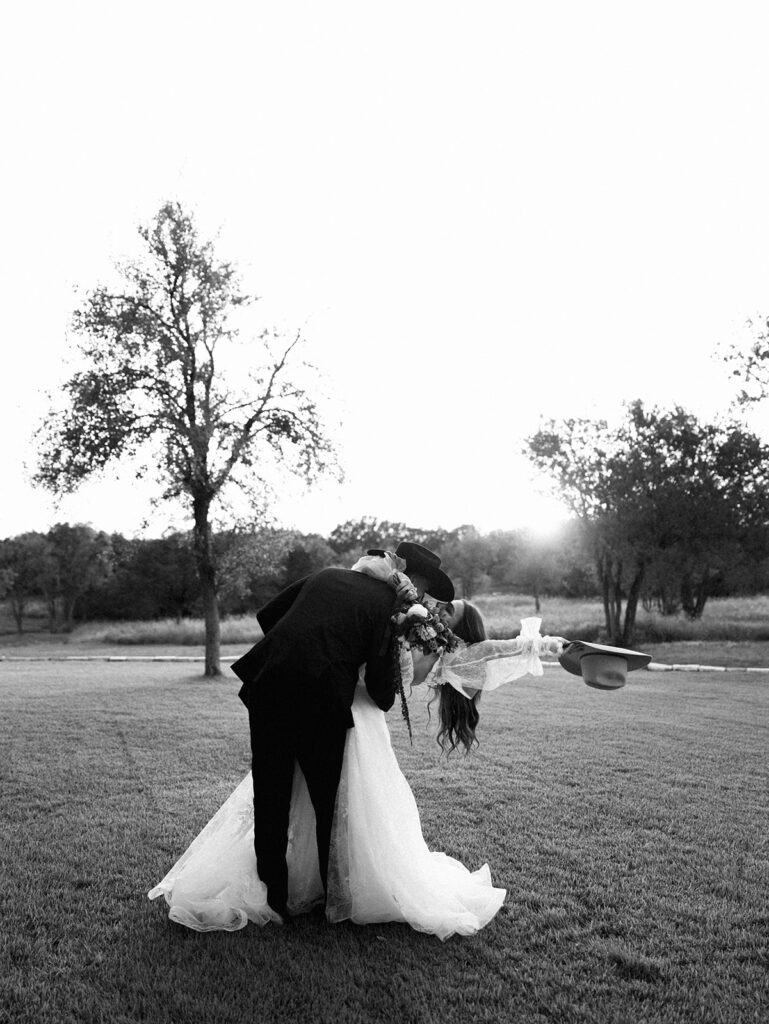 Bride and groom at The Adelphia wedding editorial in Lampasas, TX, surrounded by romantic florals and southern charm