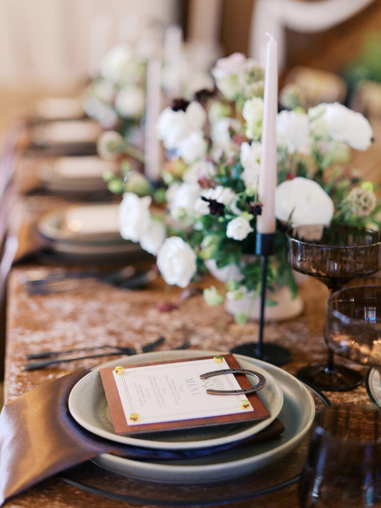 romantic southern wedding tablescape at The Adelphia with lush florals, soft candlelight, and elegant rentals styled by Simply Bliss Events.