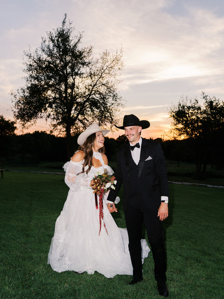 Bride and groom at The Adelphia wedding editorial in Lampasas, TX, surrounded by romantic florals and southern charm