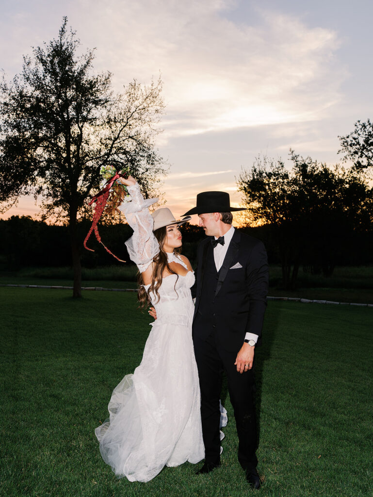 Bride and groom at The Adelphia wedding editorial in Lampasas, TX, surrounded by romantic florals and southern charm