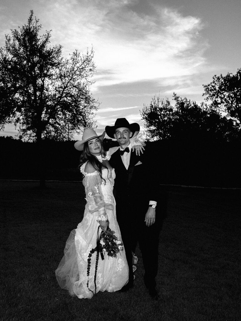 Bride and groom at The Adelphia wedding editorial in Lampasas, TX, surrounded by romantic florals and southern charm