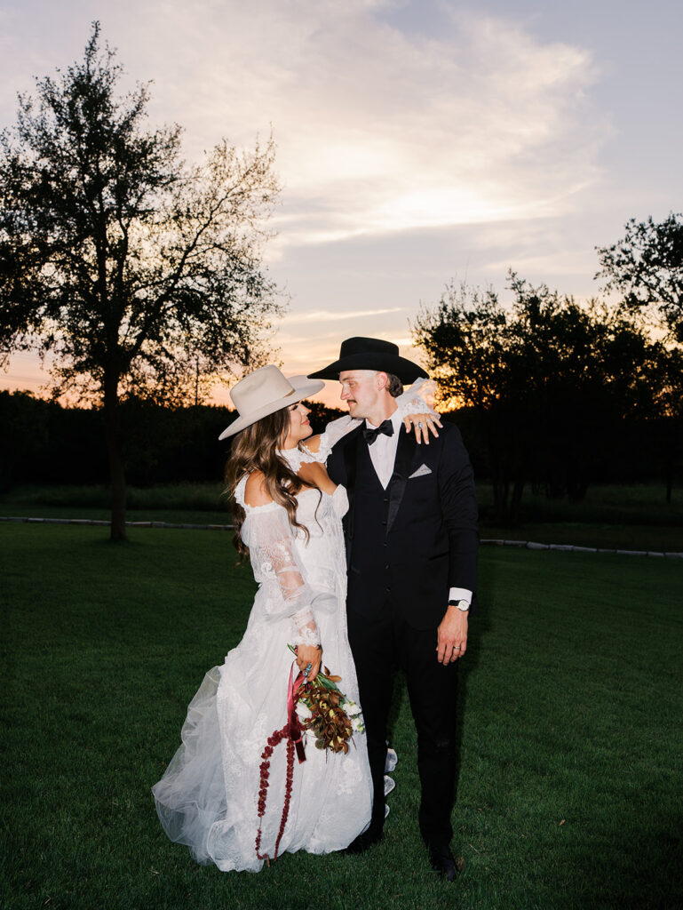 Bride and groom at The Adelphia wedding editorial in Lampasas, TX, surrounded by romantic florals and southern charm