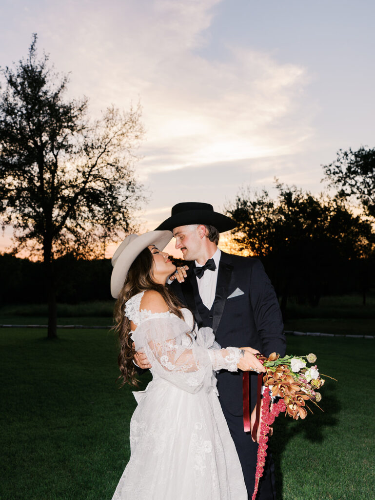 Bride and groom at The Adelphia wedding editorial in Lampasas, TX, surrounded by romantic florals and southern charm
