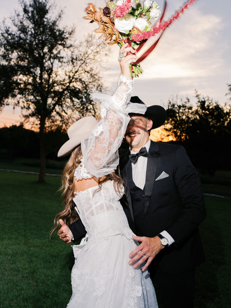 Bride and groom at The Adelphia wedding editorial in Lampasas, TX, surrounded by romantic florals and southern charm