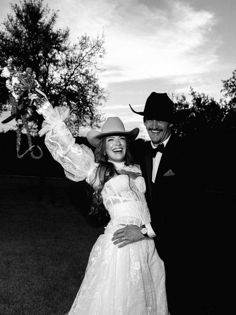 Bride and groom at The Adelphia wedding editorial in Lampasas, TX, surrounded by romantic florals and southern charm