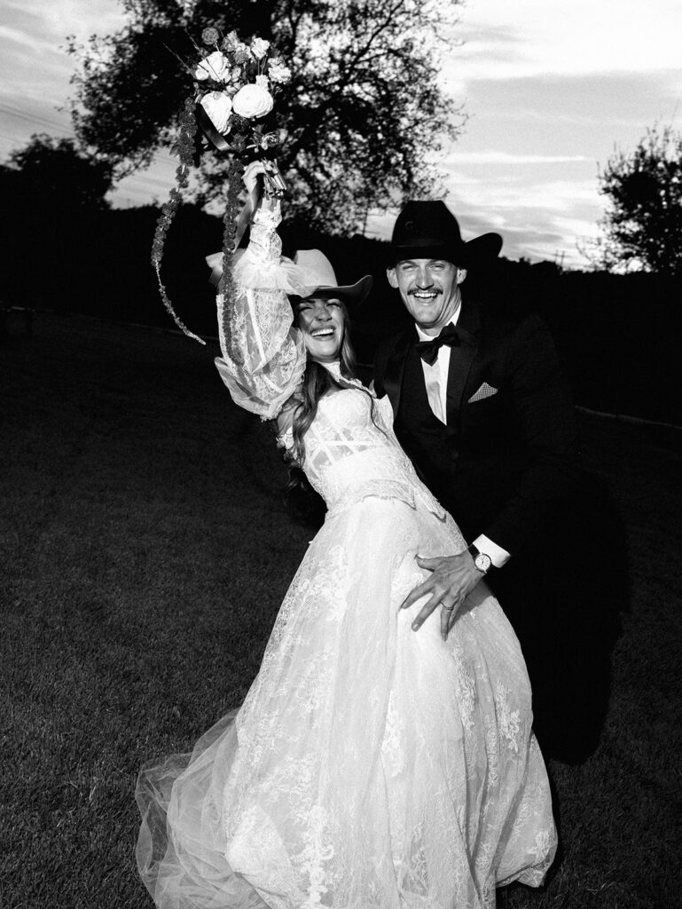 Bride and groom at The Adelphia wedding editorial in Lampasas, TX, surrounded by romantic florals and southern charm
