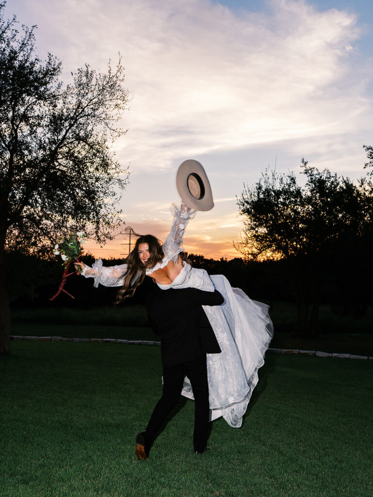 Bride and groom at The Adelphia wedding editorial in Lampasas, TX, surrounded by romantic florals and southern charm