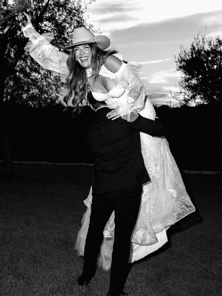 Bride and groom at The Adelphia wedding editorial in Lampasas, TX, surrounded by romantic florals and southern charm