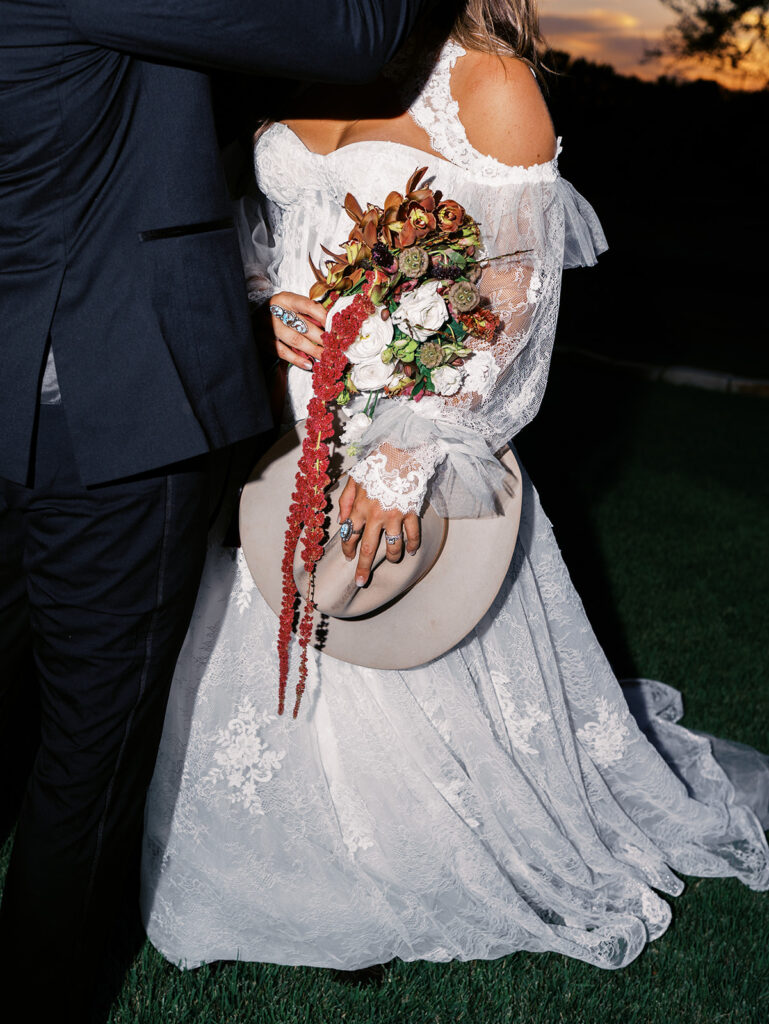 Bride and groom at The Adelphia wedding editorial in Lampasas, TX, surrounded by romantic florals and southern charm