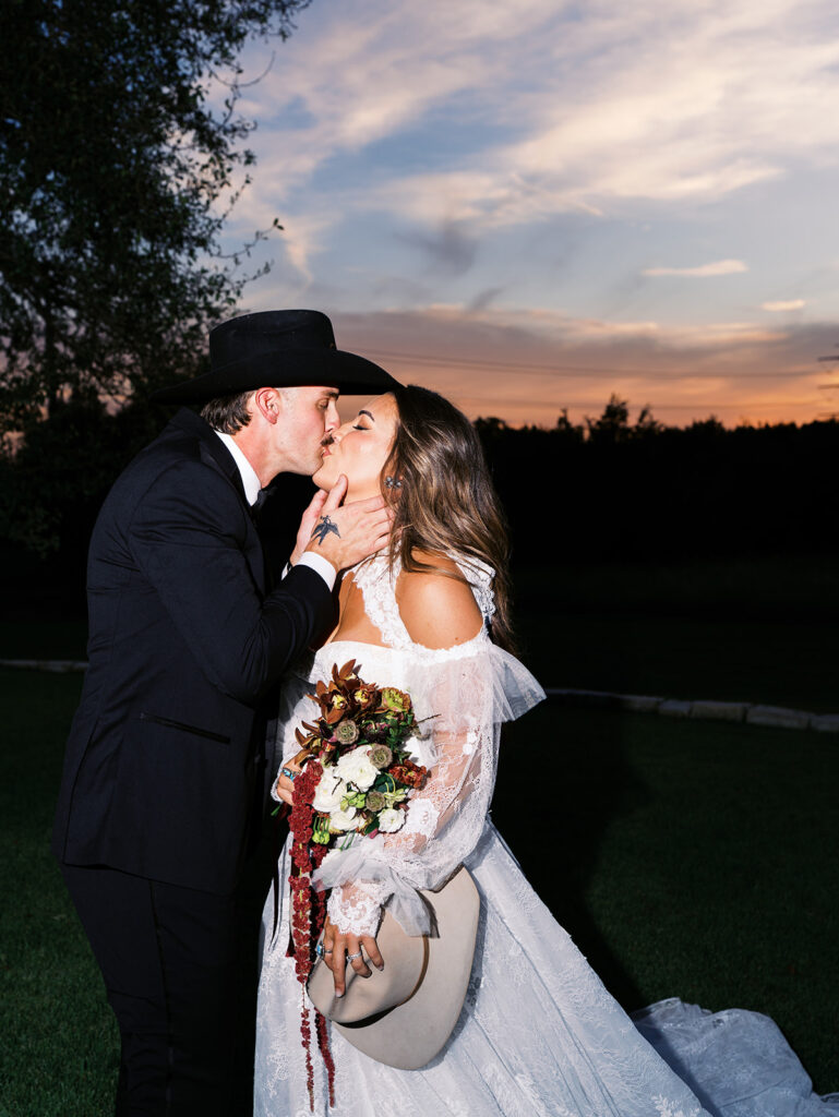 Bride and groom at The Adelphia wedding editorial in Lampasas, TX, surrounded by romantic florals and southern charm