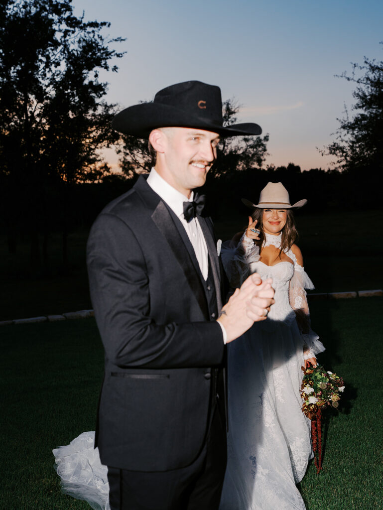 Bride and groom at The Adelphia wedding editorial in Lampasas, TX, surrounded by romantic florals and southern charm