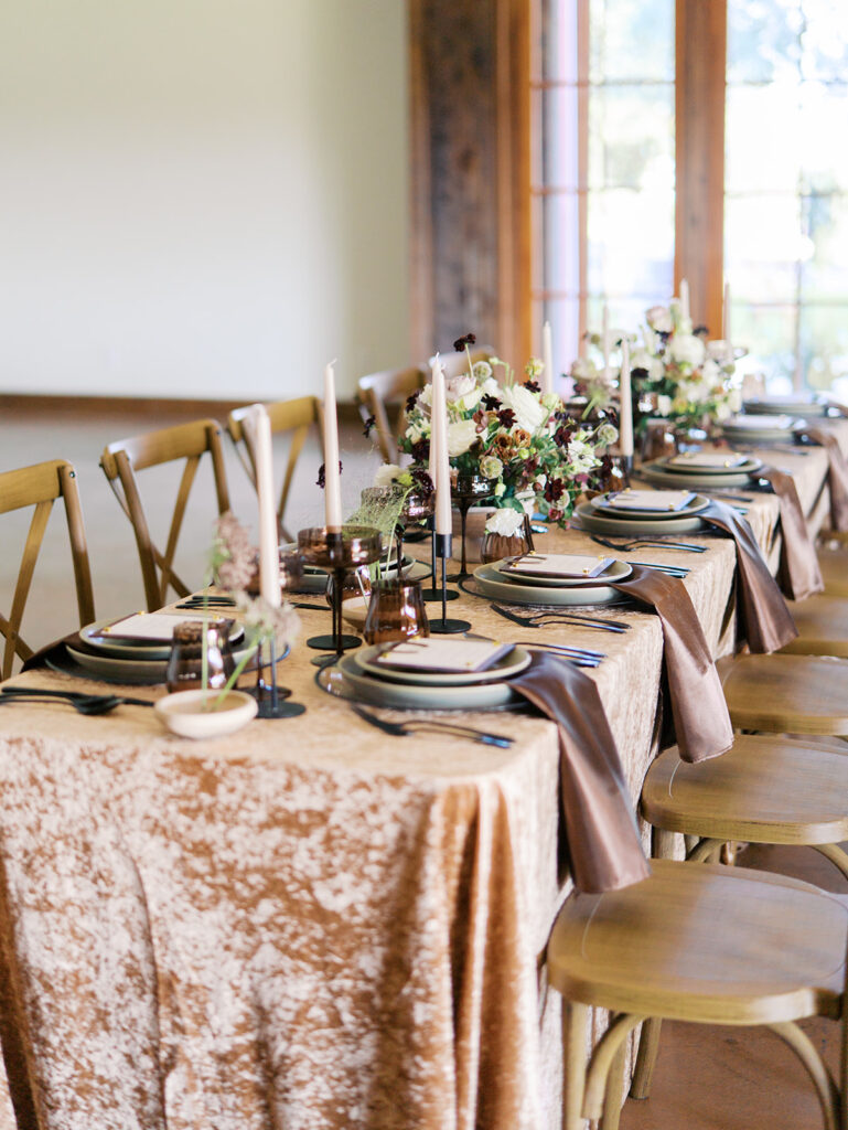 romantic southern wedding tablescape at The Adelphia with lush florals, soft candlelight, and elegant rentals styled by Simply Bliss Events.