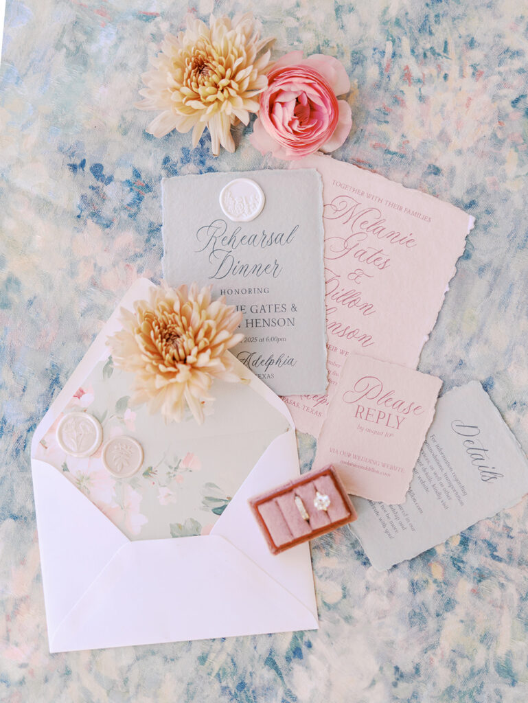 Refined wedding flat lay featuring romantic stationery by Anna & Ink, delicate florals, and timeless southern details.