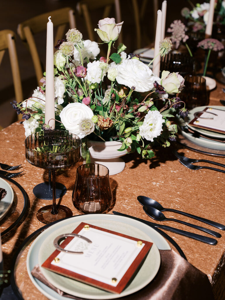 romantic southern wedding tablescape at The Adelphia with lush florals, soft candlelight, and elegant rentals styled by Simply Bliss Events.